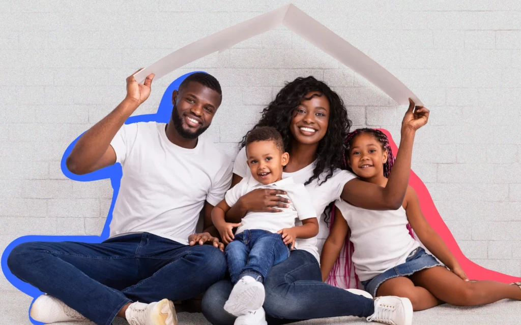 A young Black family celebrates the purchase of their new home