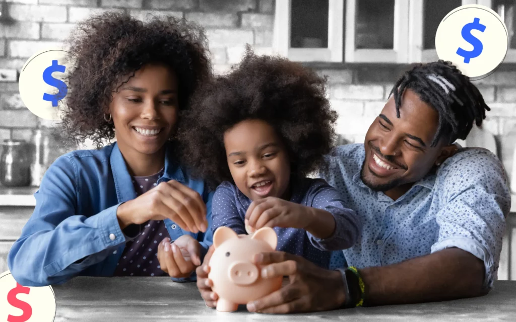 A young couple and their child place money in a piggy bank