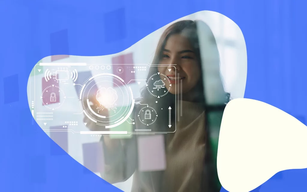 A young woman works on an interactive digital glass wall